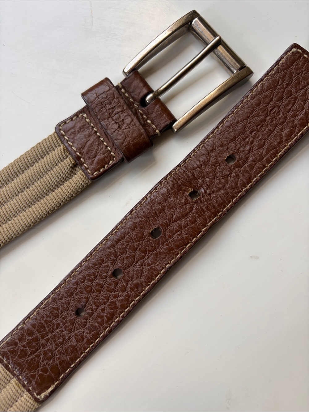 Prada belt featuring brown pebbled leather trim and a beige